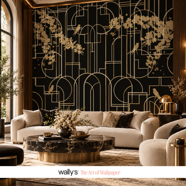 A luxury living room featuring a dramatic black and gold Art Deco style wallpaper mural as the focal point, styled with a cream sofa, marble coffee table, and warm ambient lighting. The brand name 'wallys The Art of Wallpaper' is displayed at the bottom.