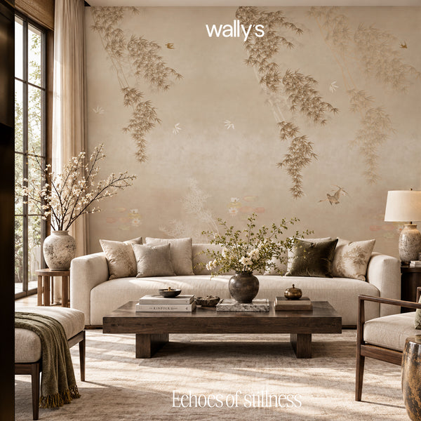 A styled living room featuring a large beige wall mural with delicate botanical branches and small birds, styled with a cream sofa, wooden coffee table, and neutral decor. The brand name 'wallys' is visible at the top.