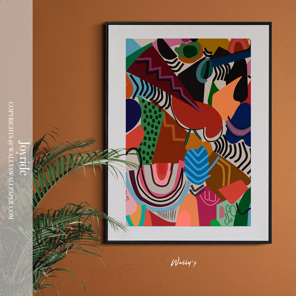 Colorful abstract art print in a black frame on a brown wall with a plant.