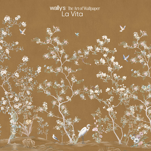Wally's 'The Art of Wallpaper La Vita' wallpaper design featuring delicate white and pink floral branches with small blue birds on a warm brown background.