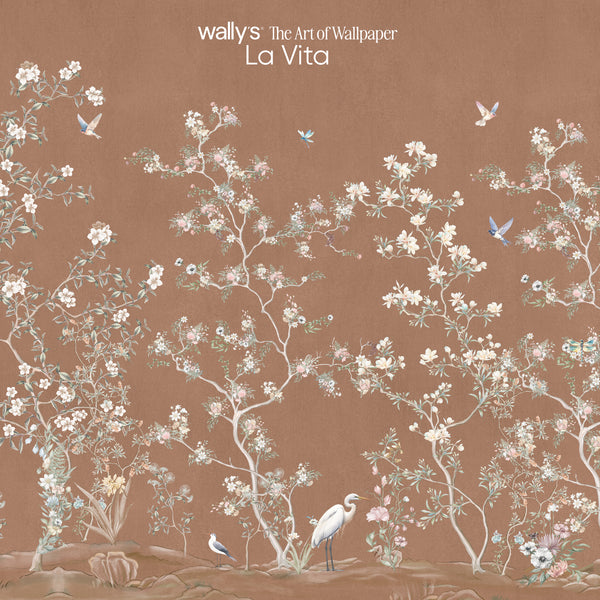 Wally's 'The Art of Wallpaper La Vita' wallpaper design featuring delicate white and pink cherry blossom branches, small blue birds, and a white heron on a warm brown background.