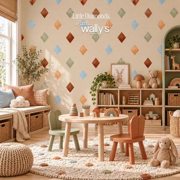 A styled children's playroom corner with a round wooden table and two small chairs in pastel green and terracotta, set on a textured cream rug. The room features a warm beige wall with a repeating pattern of small colored diamonds, wooden shelves filled with toys, a bench with cushions, and a plush bunny toy.