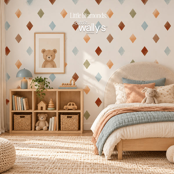 A styled children's bedroom featuring a wall with a repeating pattern of small diamond shapes in muted blue, orange, brown, and green on a warm off-white background. The room includes a light wood bed frame, textured beige rug, wooden cubby shelf with toys, and a blue lamp.