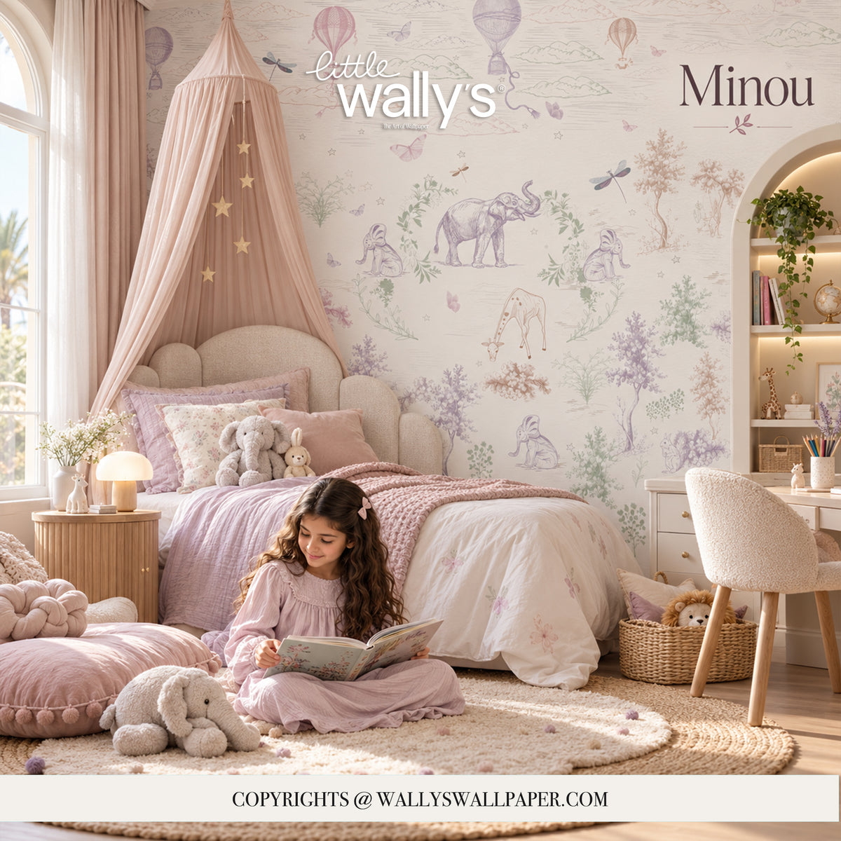 A child's bedroom scene featuring 'Minou' wallpaper by Little Wally's, with a whimsical safari-themed pattern of elephants, hot air balloons, and butterflies in soft pastel colors. The room is styled with a canopy bed, cozy bedding, a reading nook with a girl reading, and a white desk.