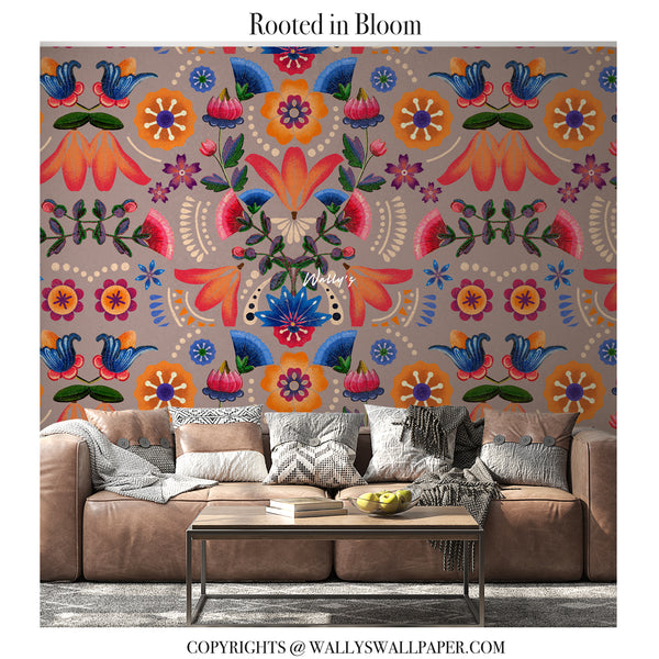Rooted in Bloom floral wallpaper featuring bold hand-drawn flowers and rich ethnic patterns in red and earthy tones, shown as a rolled wallpaper.”