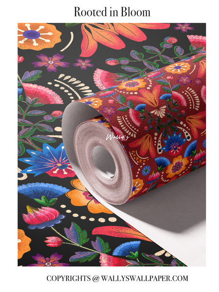 Rooted in Bloom floral wallpaper featuring bold hand-drawn flowers and rich ethnic patterns in red and earthy tones, shown as a rolled wallpaper.”