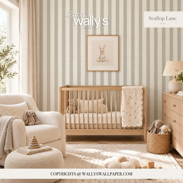 A styled nursery room featuring vertical striped wallpaper in soft sage green and cream, with a light wood crib, cozy armchair, dresser, and stuffed toys. The text 'Little Wally's' and 'Scallop Lane' appear on the wall, indicating the brand and wallpaper design.