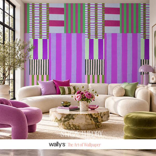 Stripe Theory purple geometric wallpaper with lilac, violet, magenta, mint green and olive striped blocks.