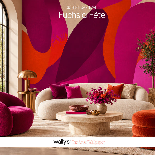 A styled living room featuring a bold abstract wallpaper mural with sweeping shapes in fuchsia, magenta, orange, and deep purple. The room includes a cream curved sofa with colorful pillows, a round stone coffee table with flowers, a magenta armchair, and a gold floor lamp.Fuchsia Fête abstract wallpaper in fuchsia burgundy and orange by Wally's Egypt