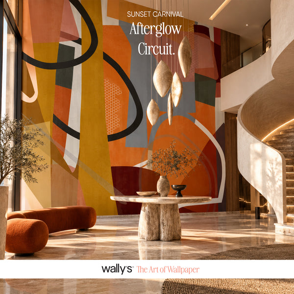 A modern interior lobby with a large abstract wall mural as the focal point. The mural features bold geometric shapes in orange, mustard yellow, gray, black, and white.