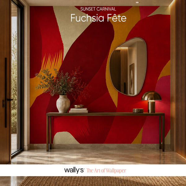 Abstract wallpaper mural featuring bold organic shapes in fuchsia pink, deep red, ochre yellow, and cream, styled in a modern entryway with a console table, mirror, and vase.