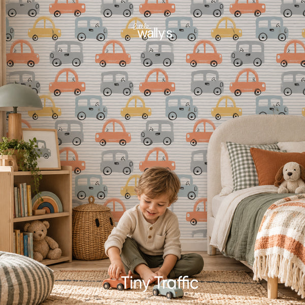 Tiny Traffic kids car wallpaper by Little Wally’s featuring hand-drawn orange, blue, mustard and grey cars in a modern children’s bedroom