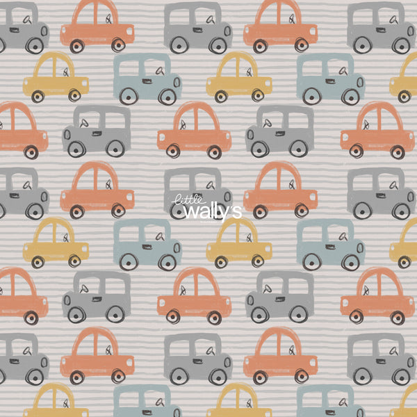 Tiny Traffic kids car wallpaper by Little Wally’s featuring hand-drawn orange, blue, mustard and grey cars in a modern children’s bedroom
