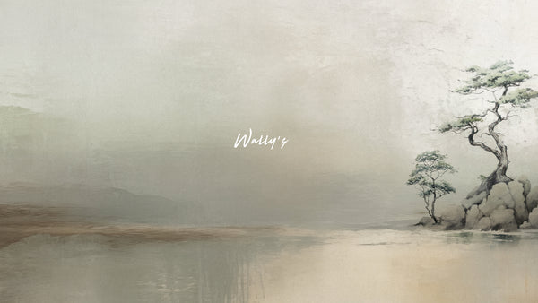 Minimal Japanese-style wallpaper mural featuring a serene tree by calm water in soft beige and sage tones, styled in a modern living room – Pino by Wally’s Wallpaper.