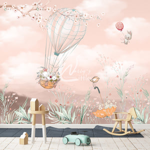 Flying Bunnies wallpaper on a peach background with blossom branch and flowers for kids rooms 